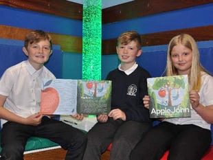 Children delighted by autumnal tale of John and the apple tree