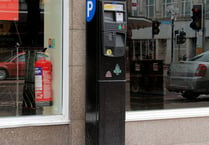 Family fined after paying for parking