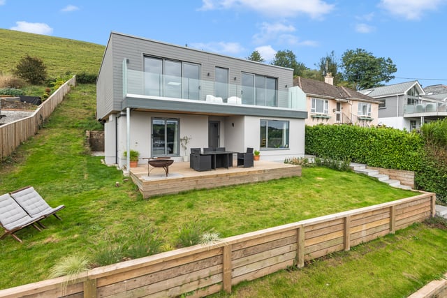 This modern home features gorgeous views and a Wi-Fi kitchen 