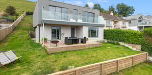 This modern home features gorgeous views and a Wi-Fi kitchen 