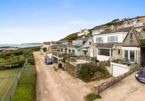 You can watch dolphins from the living room of this coastal home