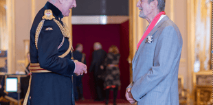 Former CEO presented with CBE in intimate Windsor Castle ceremony 
