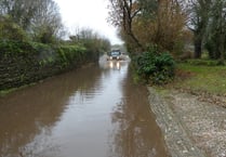 Drivers warned to slow down on flooded roads