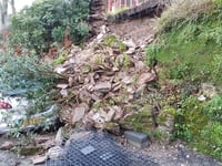 Resident hits out after wall collapse