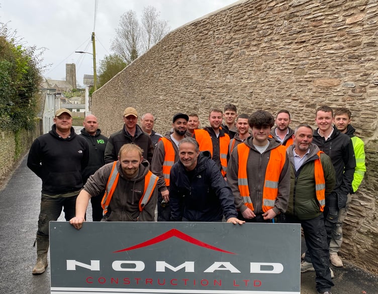 The construction workers who rebuilt the wall