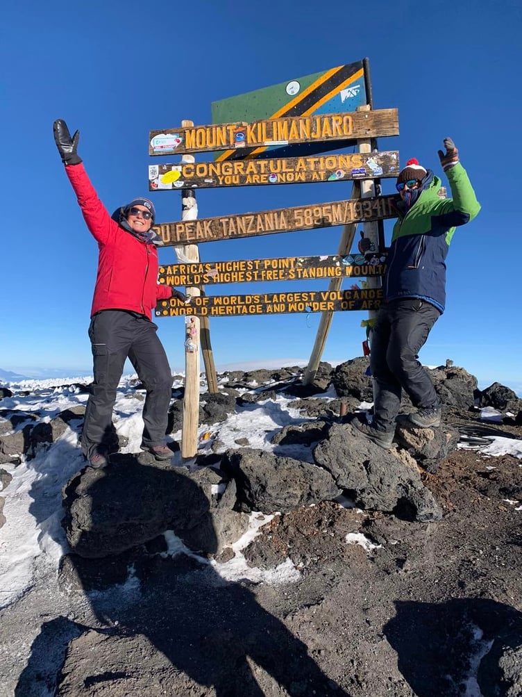 Sophie. and Lawrence Weeks reach the summit of Mount Kilimanjaro