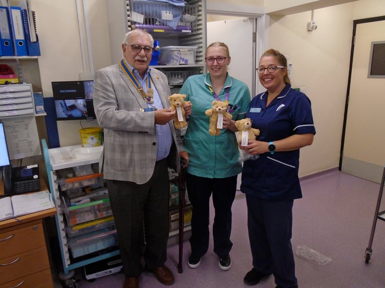 Nurses receiving teddy bears from Kingsbridge Rotary Club President Alan Thorpe