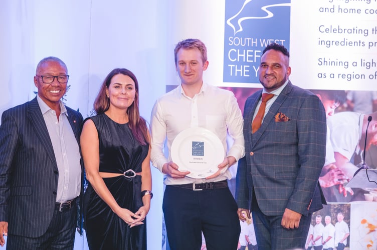 Mr Brockington (third from left) with his award