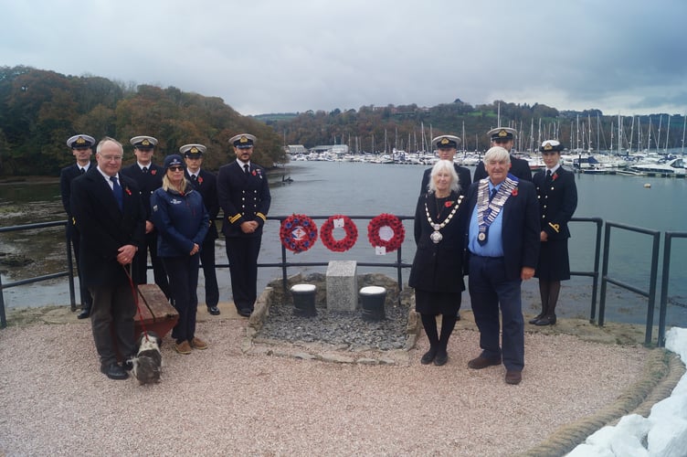 Wreaths are laid at Noss on Dart Marina at Kingswear where more than 20 people lost their lives when the shipyard was bombed during WW2. Pictured are representatives from the Britannia Royal Naval College and Noss on Dart Marina along with Kingswear Parish Council Chairman Lynne Maurer, county and district councillor Jonathan Hawkins and the Old Dartmothians President Hilary Bastone.