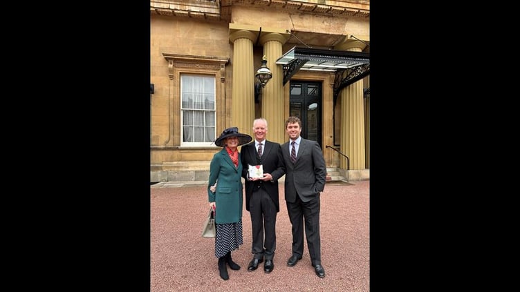 Mark with wife Hazel and son Tom at Buckingham Palace
