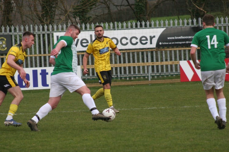 Ivybridge Town 2s player cuts inside, ready to shoot