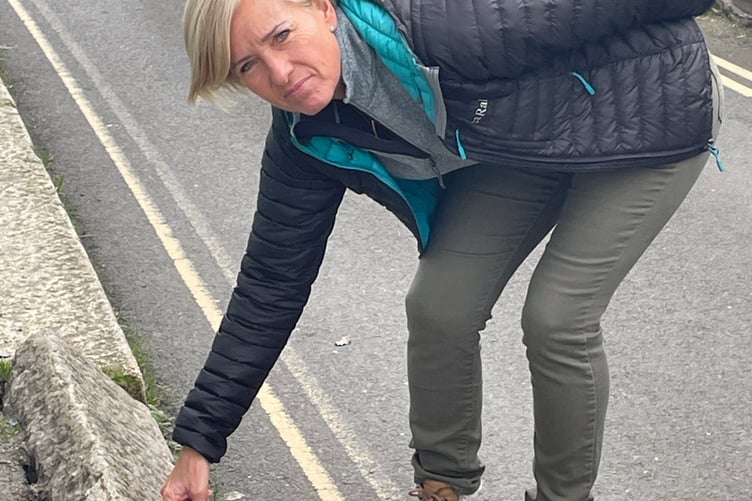 Julie points out the dangerous kerb