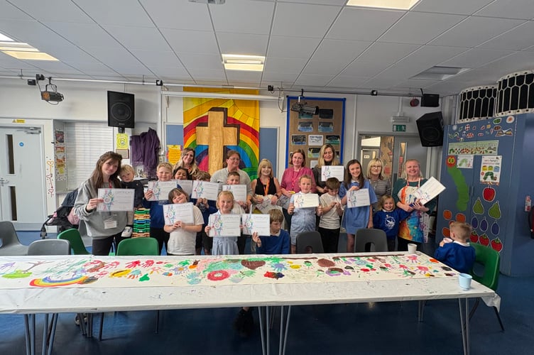 The children show off their work