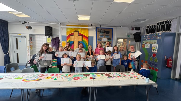 The children show off their work