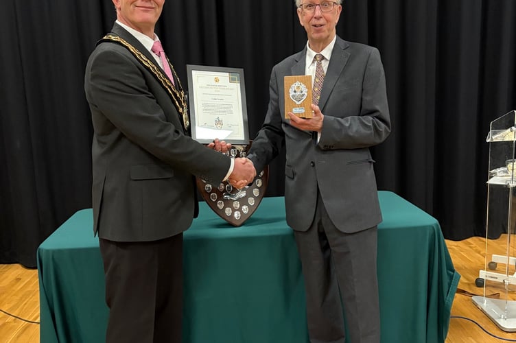 Mayor Alan Spencer presents the award to Colin Smith 