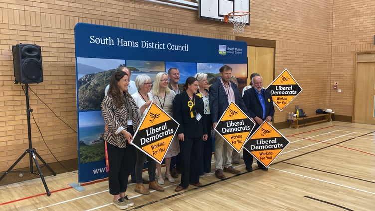 Lib Dem members pose for group shot after another win