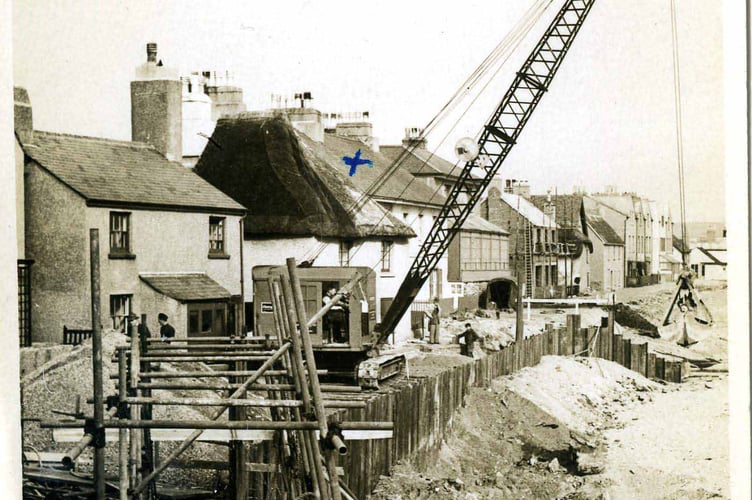Black & white postcard.  Building Sea Wall reinforcements at Torcross.