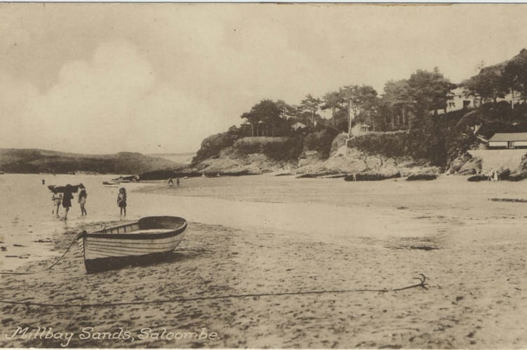 Milbay Sands, Salcombe. Small boat on the beach, children on the water.