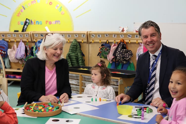 Caroline Voaden MP and Paul Adams with pupils at Furzeham Primary and Nursery School