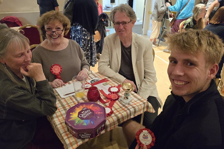 Prize winners compare rosettes