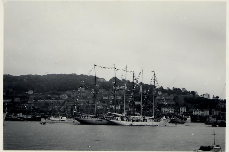 Dartmouth Regatta, Yachts in Regatta sailing race and ship dressed overall. *Creole* in background