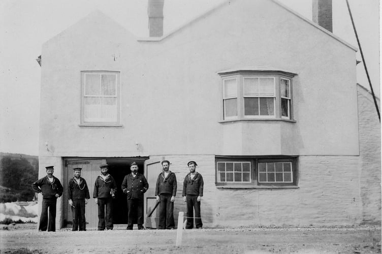 C1900 or 1896 Torcross coastguards outside watch house in their uniform.