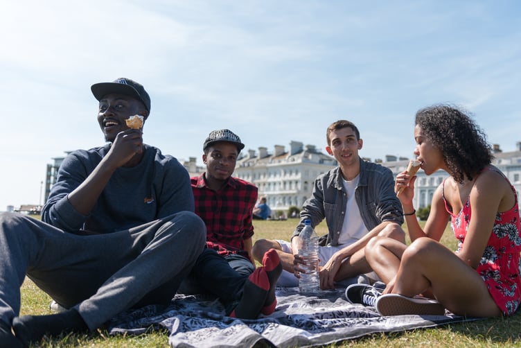 Young people gather for a picnic