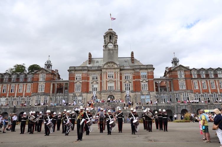The Band of the Royal Marines in front to the College