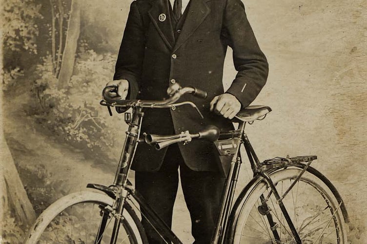 Portrait of man with bicycle around 1910.
Identified as Bert Stone, shoemaker in East Prawle