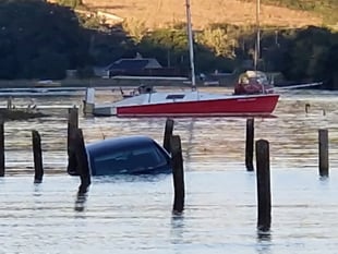 Driver and dog rescued from rising tide at Westcombe beach