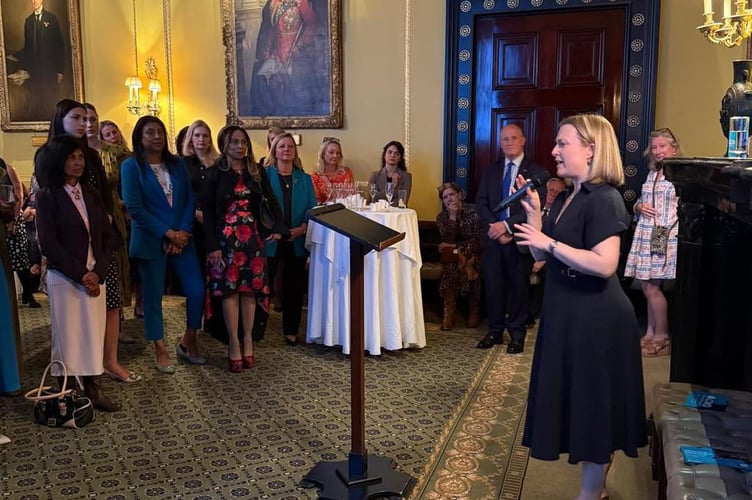 Rebecca Smith MP addresses a group of mainly women