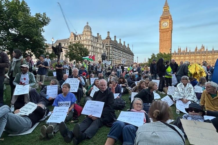 Doctor Karen Gilmore and Priest Jim Barlow at sit down protest.