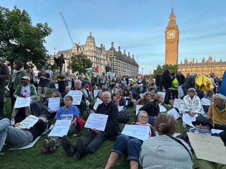 Doctor Karen Gilmore and Priest Jim Barlow at sit down protest.