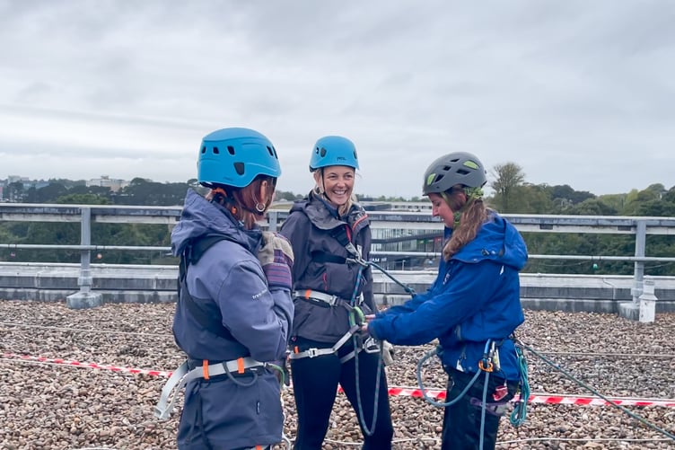 Getting set and ready to go over the edge, raising more than £40,000 for patient care in the hospital and the community.