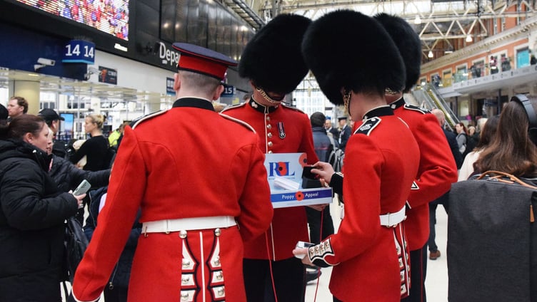 Grenadier Guards collecting at Waterloo on London Poppy Day.