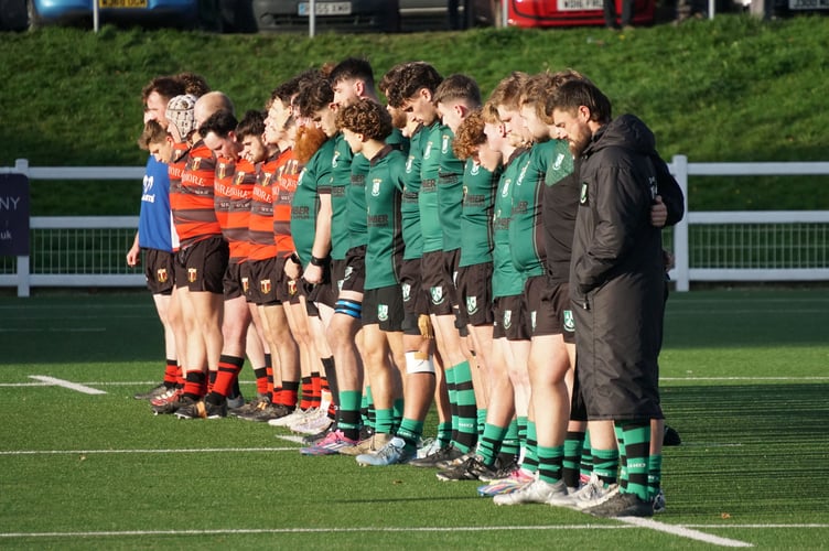 Ivybridge (in green) and Cullompton line up before their game for an act of Remembrance                     