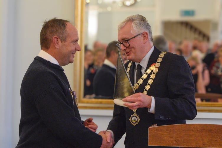 Mayor Jasper Evans presents the Citizen of the Year Award to RNLI volunteer Chris Turns