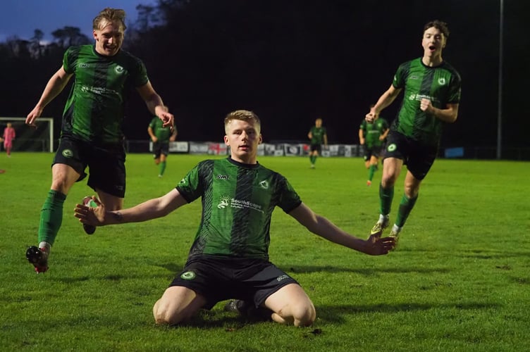 Kai Burrell celebrates one of his two goals in the win over Shepton Mallet