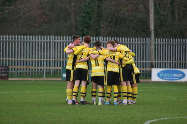 Buckland Ath huddle vs Ivybridge.