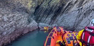 Dartmouth RNLI lifeboat crews in hide and seek training near rocks