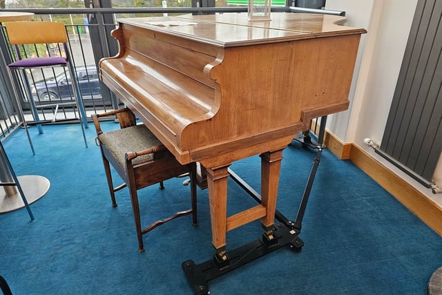 Watermark giving away baby grand piano 