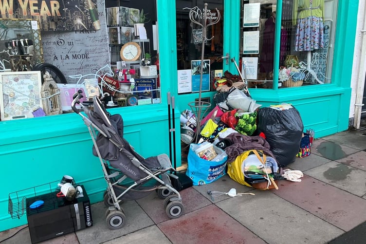 Fly tipping outside a Mare and Foal charity shop