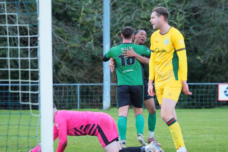 Dan Tate celebrates his goal with Jadore Lawson