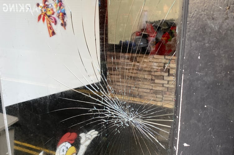 The smashed window at Kings Fried Chicken
