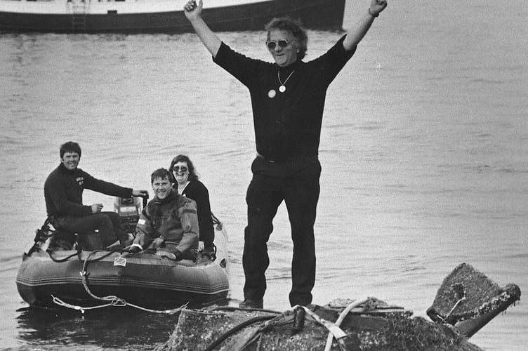 Ken Small celebrates atop his Sherman tank in May 1984