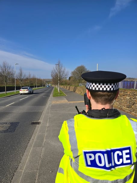 A police officer carrying out speed checks