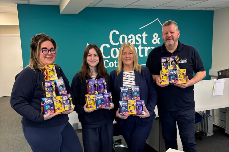 The Dartmouth team with their Easter egg donation - Coast & Country Cottages