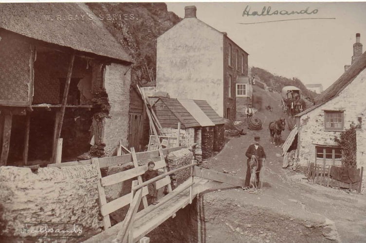 Damage to buildings at Hallsands. Man, horses and cart in road, boy on wooden 'bridge'