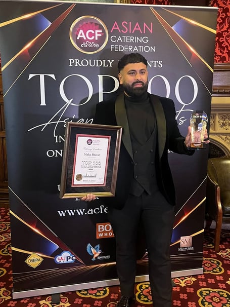 Mahi Islam with the award and  framed certificate