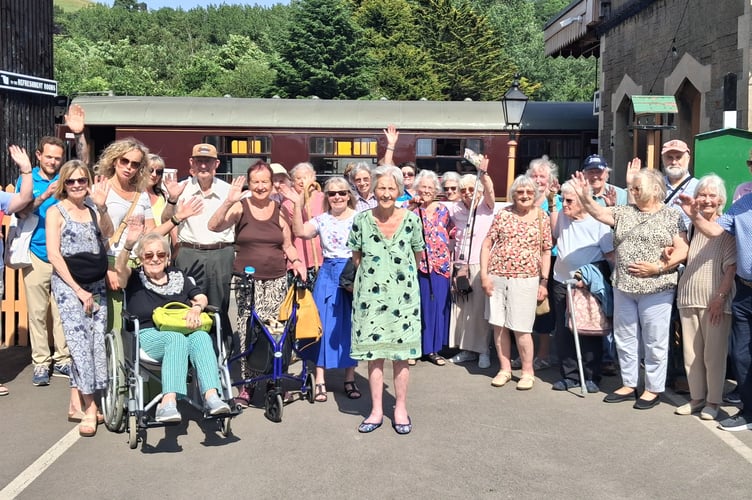 A group photograph of the happy travellers at Buckfastleigh Station